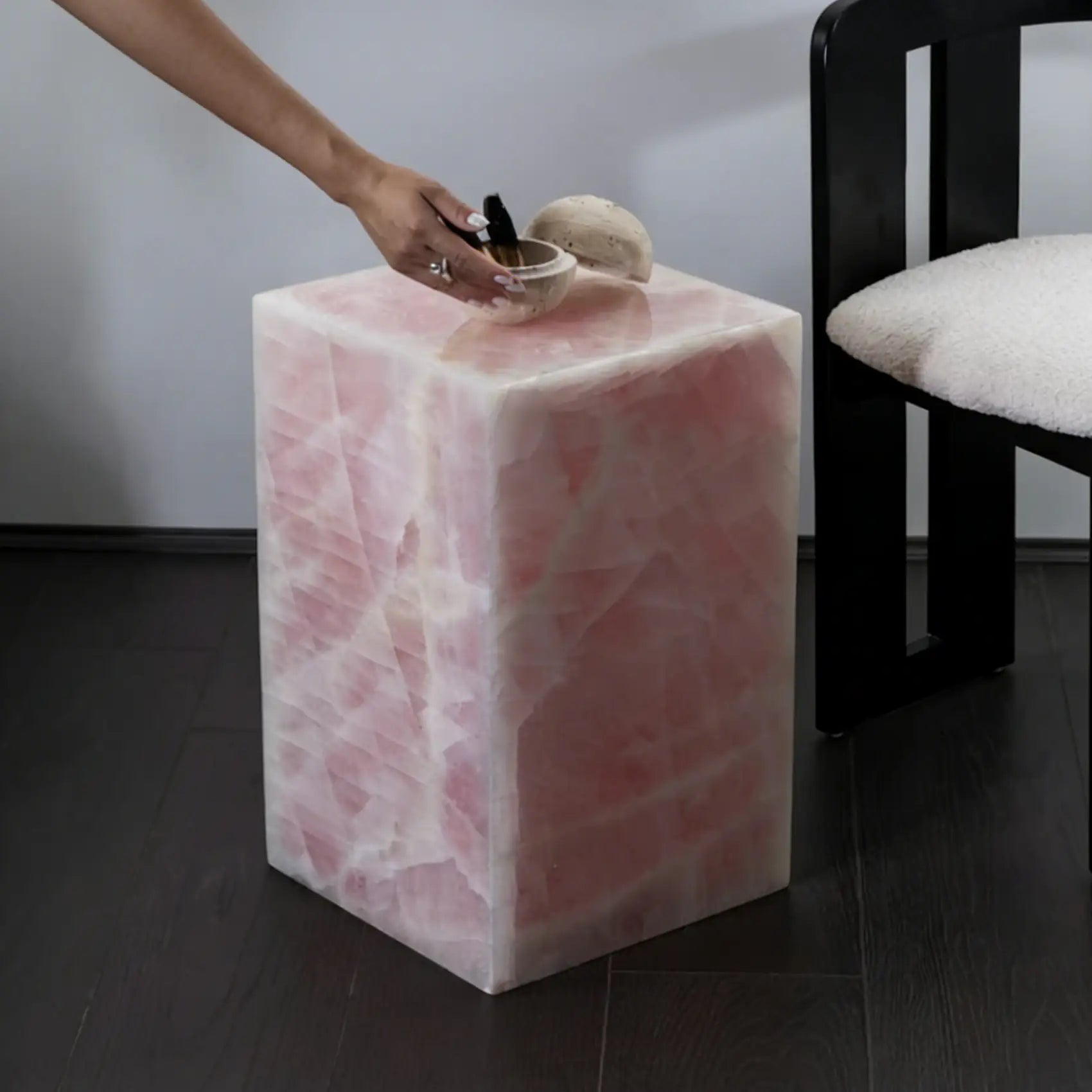 Pink marble plinth styled as side table in living room - Kozy Nest Australia